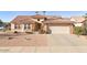 Charming single-story home with a tile roof and a well-maintained front yard at 23114 N 146Th Dr, Sun City West, AZ 85375