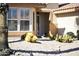 Landscaped front yard featuring desert plants and a decorative bay window at 23114 N 146Th Dr, Sun City West, AZ 85375