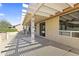 Covered outdoor patio with nice columns and a pergola, offering relaxing backyard space at 23114 N 146Th Dr, Sun City West, AZ 85375