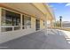 Covered patio area offering ample space for outdoor seating and entertaining, with views of the backyard at 23114 N 146Th Dr, Sun City West, AZ 85375