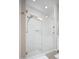 Bright bathroom featuring a glass shower with white subway tile and window at 23448 N 76Th Pl, Scottsdale, AZ 85255