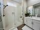 Sleek bathroom featuring a glass walk-in shower, white vanity, and contemporary finishes at 23448 N 76Th Pl, Scottsdale, AZ 85255