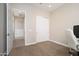 Neutral bedroom with a closet, desk, and a view into the hall at 23448 N 76Th Pl, Scottsdale, AZ 85255