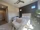 Tranquil bedroom featuring modern accents, natural light, and a comfortable seating area at 23448 N 76Th Pl, Scottsdale, AZ 85255