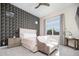 Serene bedroom with decorative accent wall and natural light at 23448 N 76Th Pl, Scottsdale, AZ 85255