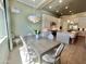 An inviting dining room featuring a stylish table, contemporary lighting, and an abundance of natural light at 23448 N 76Th Pl, Scottsdale, AZ 85255