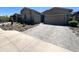 Charming home featuring a two-car garage, attractive brick driveway, and desert landscaping in a warm, sunny setting at 23448 N 76Th Pl, Scottsdale, AZ 85255