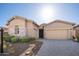 Inviting single-Gathering home featuring a three-car garage and desert landscaping at 23448 N 76Th Pl, Scottsdale, AZ 85255