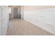 Elegant hallway with wood-look tile floors and custom wainscoting at 23448 N 76Th Pl, Scottsdale, AZ 85255