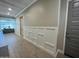 Inviting hallway with beautiful wood-look tile flooring, crisp white wainscoting, and recessed lighting at 23448 N 76Th Pl, Scottsdale, AZ 85255