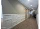 Inviting hallway with beautiful wood-look tile flooring, crisp white wainscoting, and recessed lighting at 23448 N 76Th Pl, Scottsdale, AZ 85255