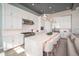 Modern kitchen with white cabinets, large island, stainless steel appliances, and pendant lighting at 23448 N 76Th Pl, Scottsdale, AZ 85255