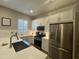 Modern kitchen showcasing stainless steel appliances, white cabinets, and countertops at 23448 N 76Th Pl, Scottsdale, AZ 85255