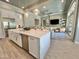 Spacious open concept kitchen featuring an island, stainless steel appliances, and seamless access to the living room at 23448 N 76Th Pl, Scottsdale, AZ 85255