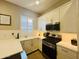 Modern kitchen with white cabinetry, stainless steel appliances, and a gas range stove at 23448 N 76Th Pl, Scottsdale, AZ 85255