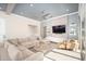 Cozy living room featuring a large sectional sofa and built-in shelving at 23448 N 76Th Pl, Scottsdale, AZ 85255
