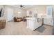 Stylish living room with an open floor plan, stainless steel sink, and natural light at 23448 N 76Th Pl, Scottsdale, AZ 85255