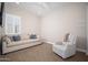 Cozy living room with comfortable seating, neutral colors, and a ceiling fan at 23448 N 76Th Pl, Scottsdale, AZ 85255