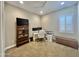 Well-lit home office featuring a desk, bookcase, and storage, perfect for productivity at 23448 N 76Th Pl, Scottsdale, AZ 85255