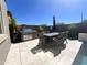 Outdoor patio with a dining table, chairs, and grill, perfect for entertaining at 23448 N 76Th Pl, Scottsdale, AZ 85255