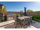Outdoor patio with a built-in BBQ grill and an outdoor dining set, perfect for entertaining at 23448 N 76Th Pl, Scottsdale, AZ 85255
