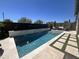 Sparkling swimming pool with luxurious lounge chairs and pristine landscaping at 23448 N 76Th Pl, Scottsdale, AZ 85255