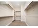 Spacious walk-in closet with built-in shelving and ample storage space at 23448 N 76Th Pl, Scottsdale, AZ 85255