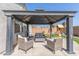 Patio with gazebo and comfortable wicker furniture at 23625 N El Frio Ct, Sun City, AZ 85373