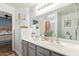 Double vanity bathroom with a view of the bedroom at 23625 N El Frio Ct, Sun City, AZ 85373