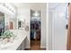 Bathroom with double vanity, walk-in closet, and shower at 23625 N El Frio Ct, Sun City, AZ 85373