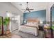 Spacious bedroom featuring a wood accent wall and ceiling fan at 23625 N El Frio Ct, Sun City, AZ 85373