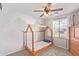 bedroom with wood bed frame and mountain-themed wall art at 23625 N El Frio Ct, Sun City, AZ 85373