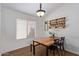 Small dining area with wood table, chairs, and wine rack at 23625 N El Frio Ct, Sun City, AZ 85373