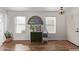 Bright entryway with wood floors and a vintage mirror at 23625 N El Frio Ct, Sun City, AZ 85373