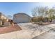 Front view of a single-story house with a driveway and landscaping at 23625 N El Frio Ct, Sun City, AZ 85373