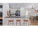 Modern kitchen with dark countertops and white cabinets at 23625 N El Frio Ct, Sun City, AZ 85373