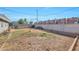 Backyard with a view of neighboring buildings and a small tree at 2641 W Wethersfield Rd, Phoenix, AZ 85029