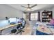 Bedroom with a bed, desk, and built-in shelving at 2641 W Wethersfield Rd, Phoenix, AZ 85029