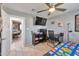 Bedroom with workspace and large TV at 2641 W Wethersfield Rd, Phoenix, AZ 85029