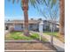 Ranch style home with mature landscaping and a paved walkway at 2641 W Wethersfield Rd, Phoenix, AZ 85029