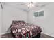 Bedroom with ceiling fan and patterned bedding at 2650 W Union Hills Dr # 108, Phoenix, AZ 85027