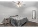 King-size bed and ceiling fan in this restful bedroom at 2650 W Union Hills Dr # 108, Phoenix, AZ 85027