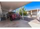 Covered carport with a red pickup truck parked underneath at 2650 W Union Hills Dr # 108, Phoenix, AZ 85027