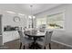 Dining area with a round table and four gray chairs at 2650 W Union Hills Dr # 108, Phoenix, AZ 85027