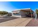 Mobile home with carport, landscaping, and paved driveway at 2650 W Union Hills Dr # 108, Phoenix, AZ 85027