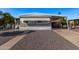 Gray mobile home with carport and paved driveway at 2650 W Union Hills Dr # 108, Phoenix, AZ 85027