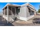 Mobile home exterior with steps and screened porch at 2650 W Union Hills Dr # 108, Phoenix, AZ 85027