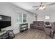 Living area with brown leather recliners and a view to the kitchen at 2650 W Union Hills Dr # 108, Phoenix, AZ 85027