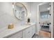 Bright bathroom featuring a sink, white countertops, and a round mirror with stylish decor at 2752 E Pelican Ct, Gilbert, AZ 85297