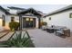 Beautiful landscaped front yard with pavers and a covered entry and outdoor furniture at 2752 E Pelican Ct, Gilbert, AZ 85297